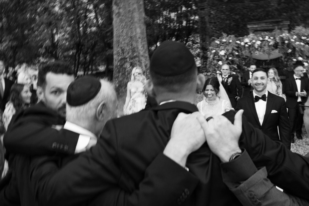 Bride and groom exiting chuppah Villa Lenka